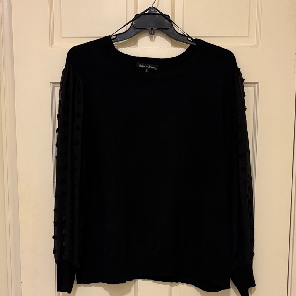 Chic Black Sweater with Sheer Dotted Sleeves